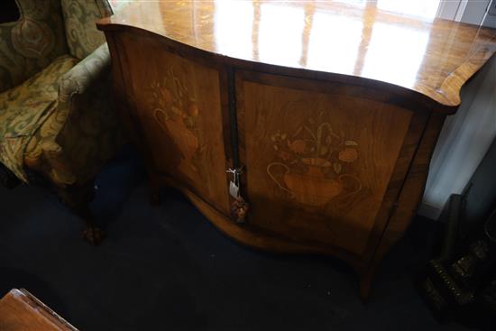 A late 19th century French marquetry inlaid serpentine commode, W.3ft 10in. D.1ft 8in. H.2ft 8.5in.